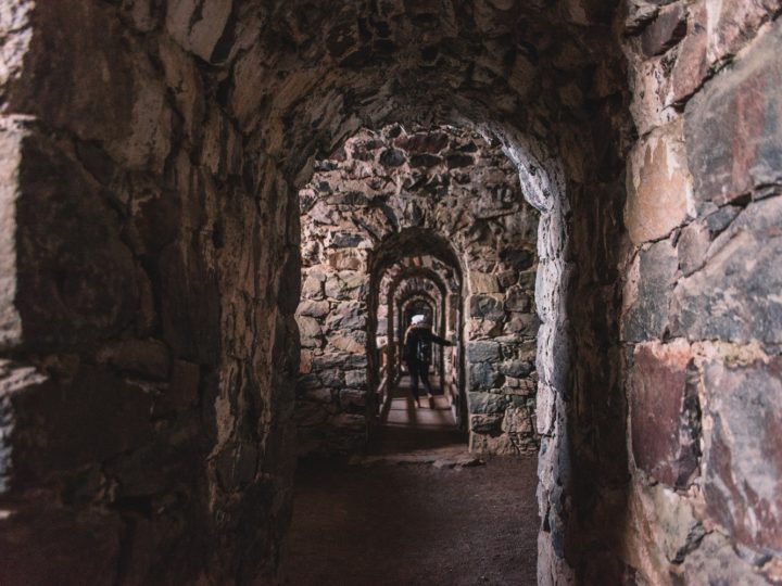 Woman walking in Suomenlinna Sea Fortress in Helsinki