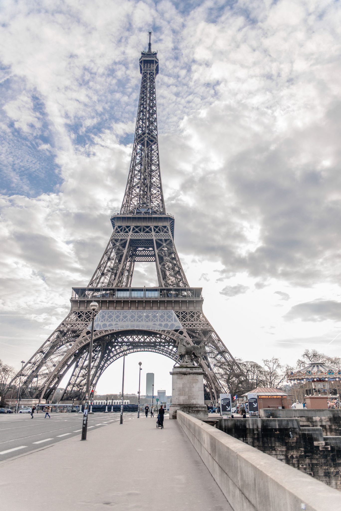 The Eiffel Tower with a dramatic sky in the background