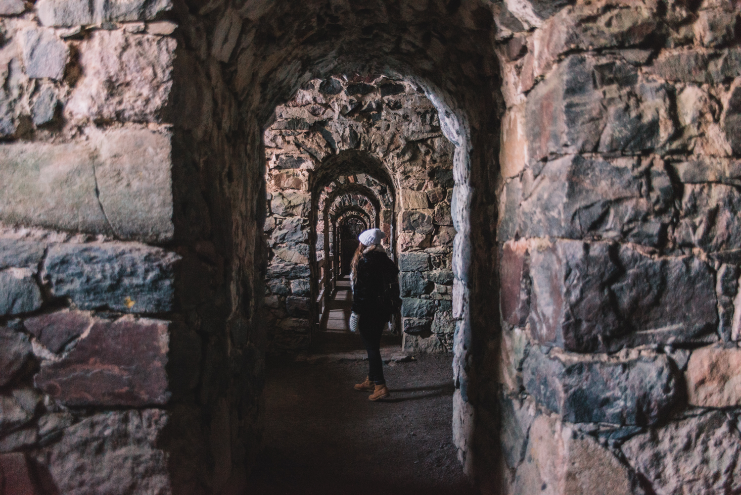 Woman walking in Suomenlinna Sea Fortress in Helsinki