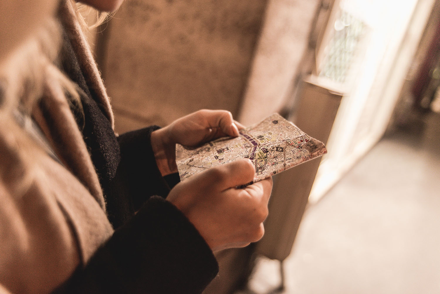 Woman reading a map in Paris