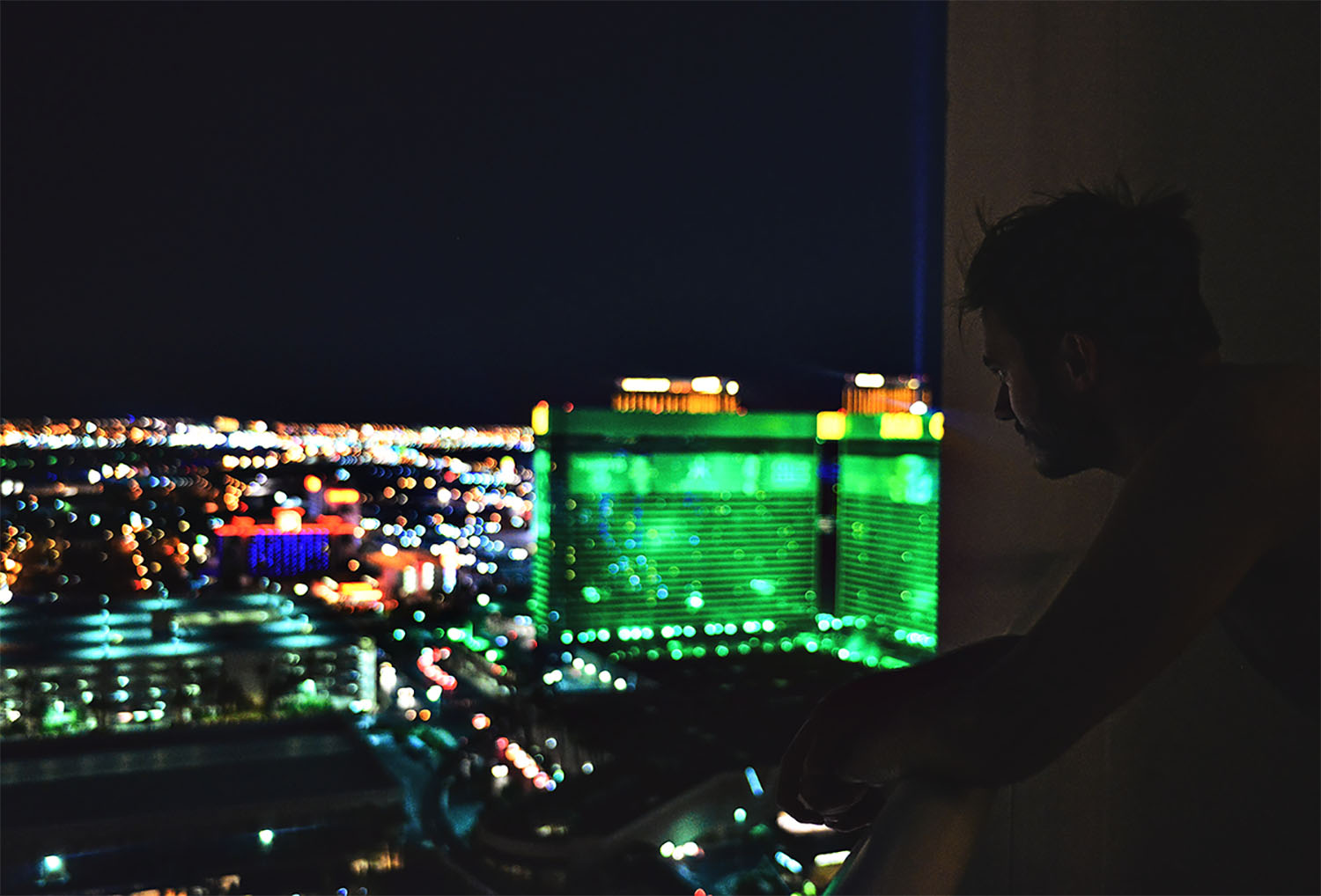 Man standing on balcony at The Signature at MGM Grand