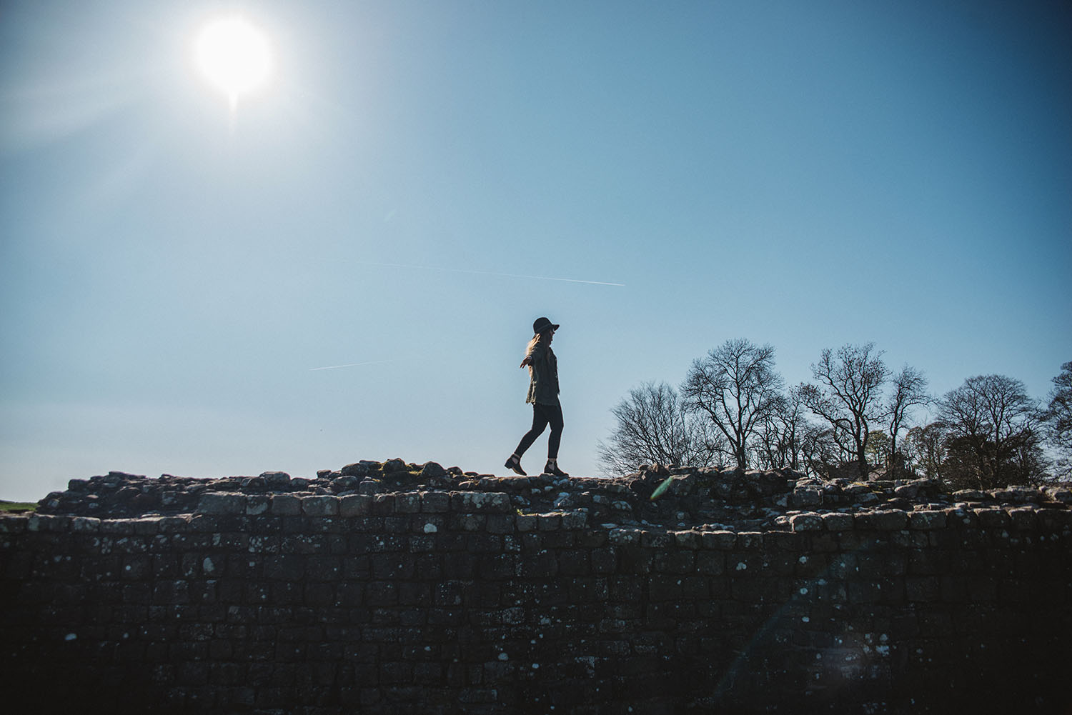 Girl walking on Hadrian's Wall in Cumbria