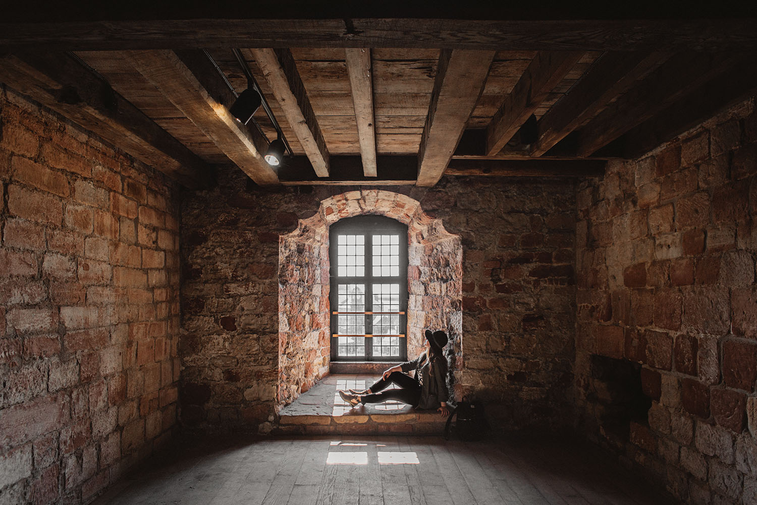 Woman sitting in window in Carlisle Castle