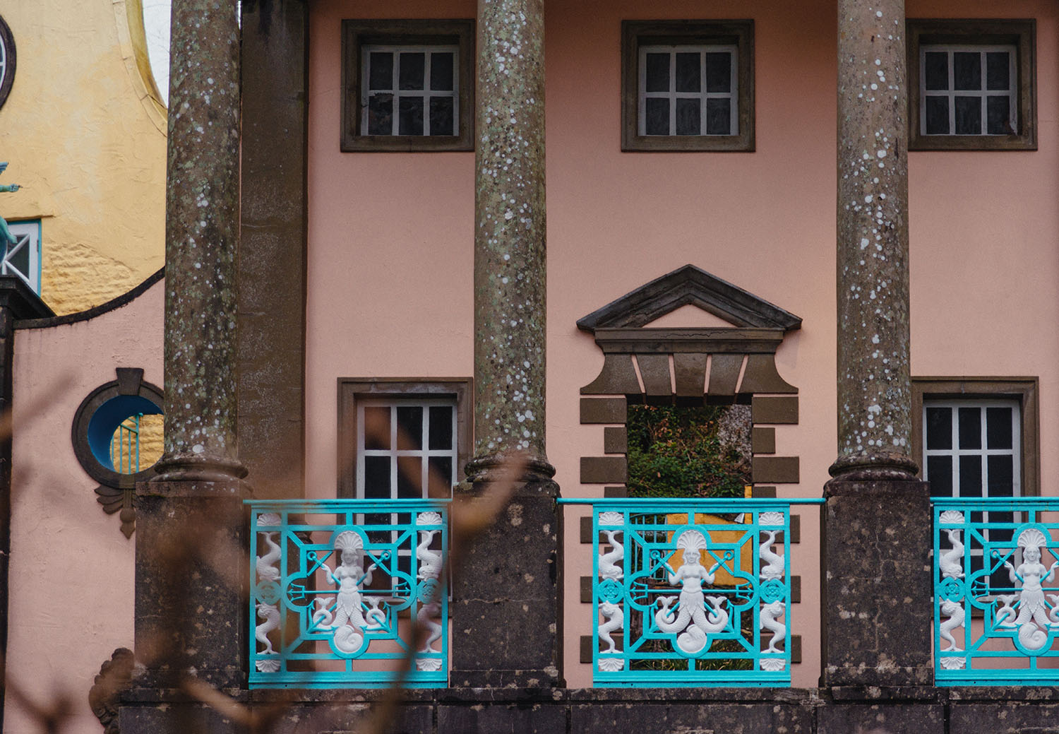 Blue and white gate panel depicting a mermaid in Portmeirion village North West Wales