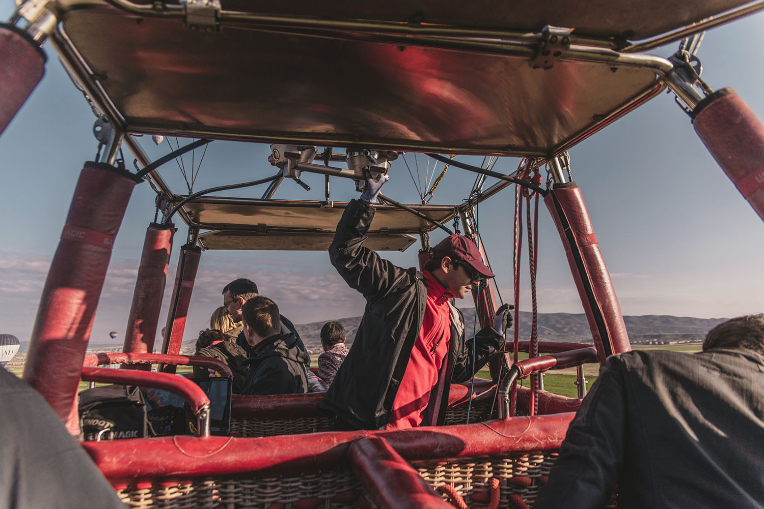 In a hot air balloon basket in Turkey with Voyager Balloons