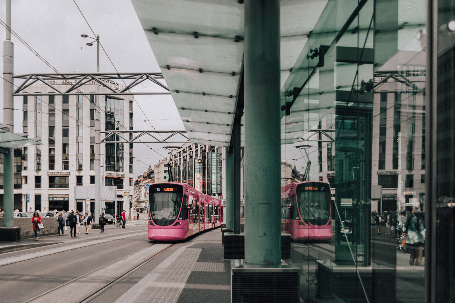 Pink Tram coming in at Geneva Train and Tram Station