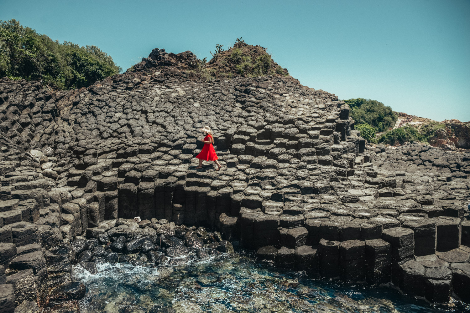 Adaras at Ganh Da Dia in Phu Yen, Vietnam | Girl in Red Dress Walking on basalt rock columns