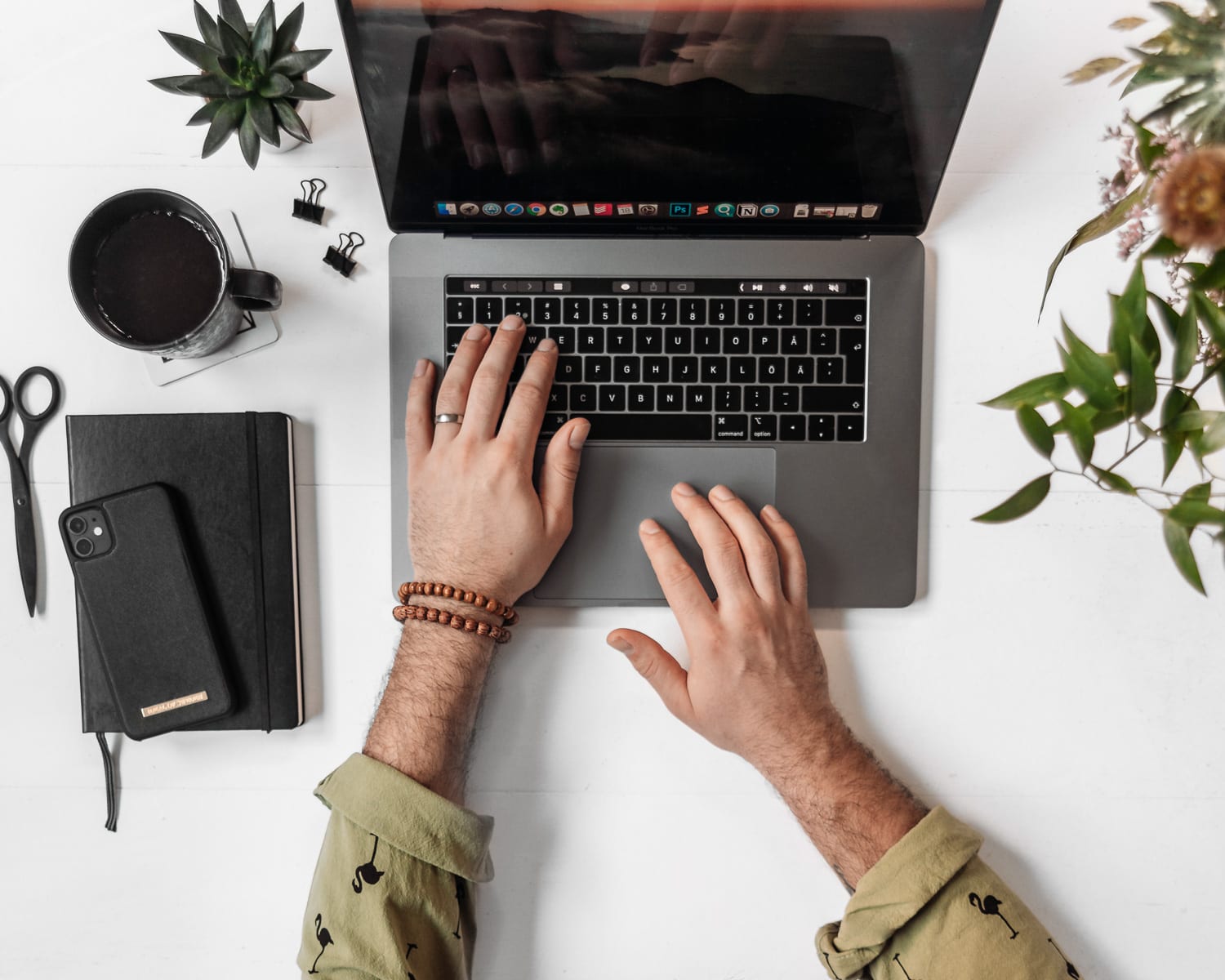 Telecommuting: Man Working on Macbook Pro Laptop