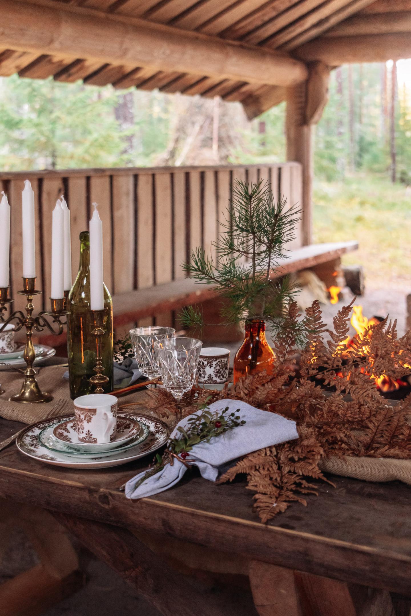 Beautfilly set wooden table in the woods by Fröken Julies Porslin in Örebro.