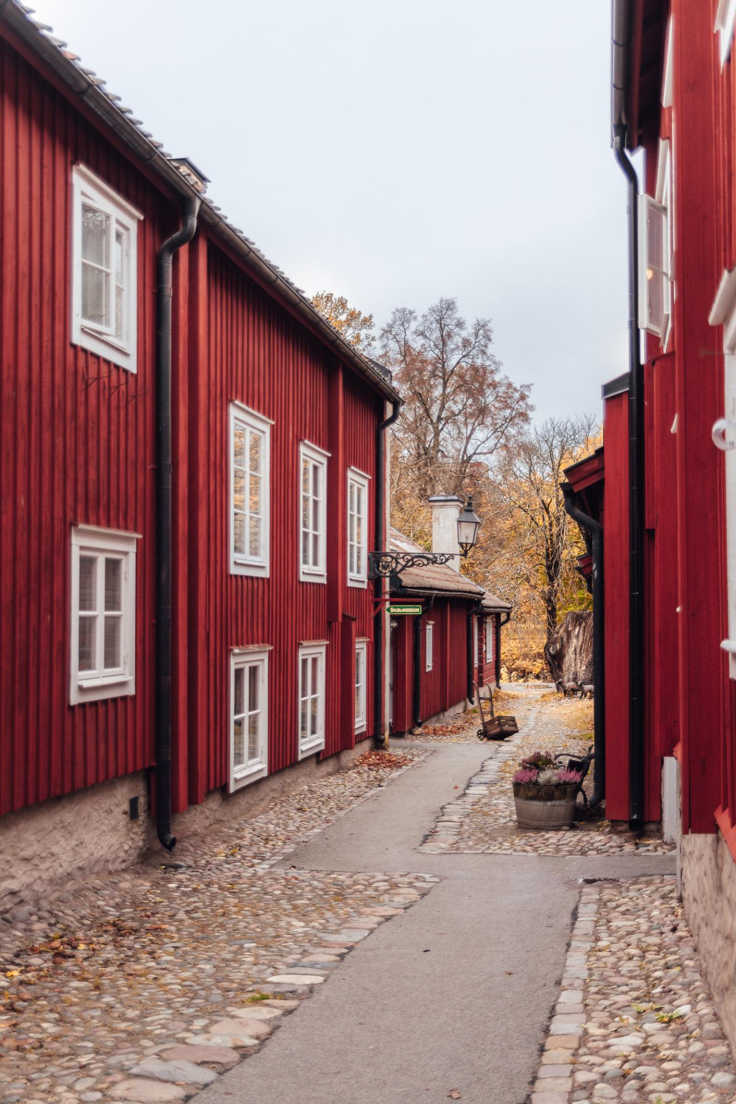 Beautiful street with red buildings in the open-air museum Wadköping, Örebro