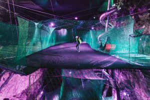 Man bouncing in Bounce Below - Underground Trampolines in North Wales