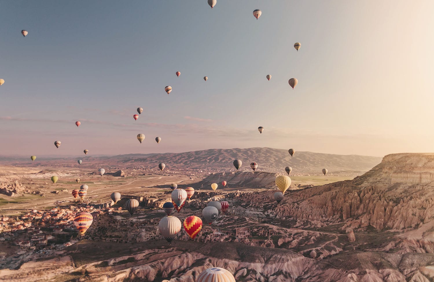 Surreal view: Hot air balloons in beautiful sunrise in Cappadocia, Turkey