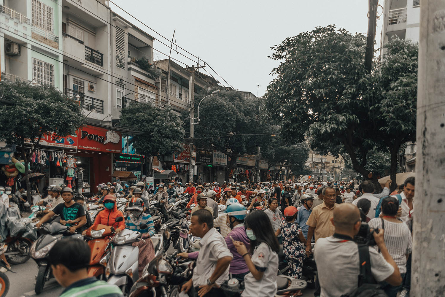 Busy street with mopeds in Ho Chi Minh City, Vietnam